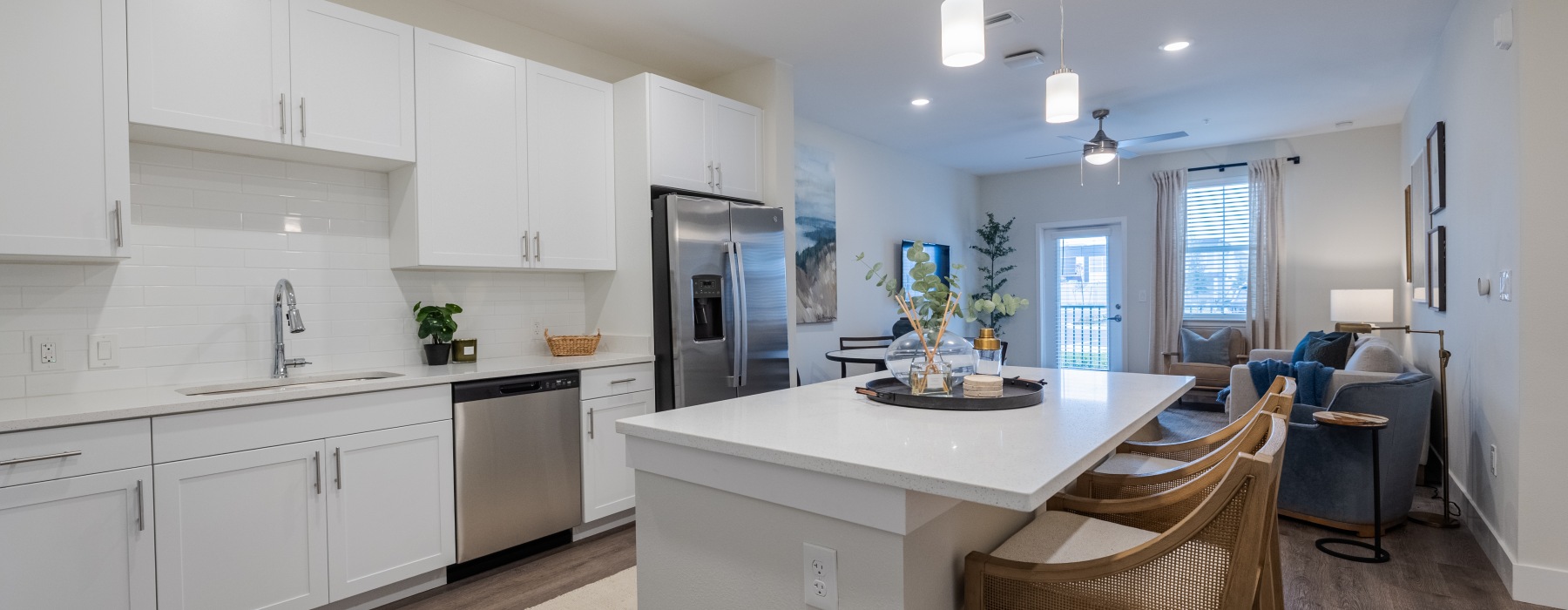 Open living room with contemporary finishes at Madison Midtown apartments in Melbourne FL.