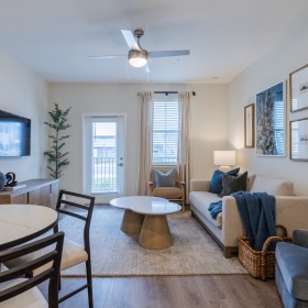 Open living room with contemporary finishes at Madison Midtown apartments in Melbourne FL.